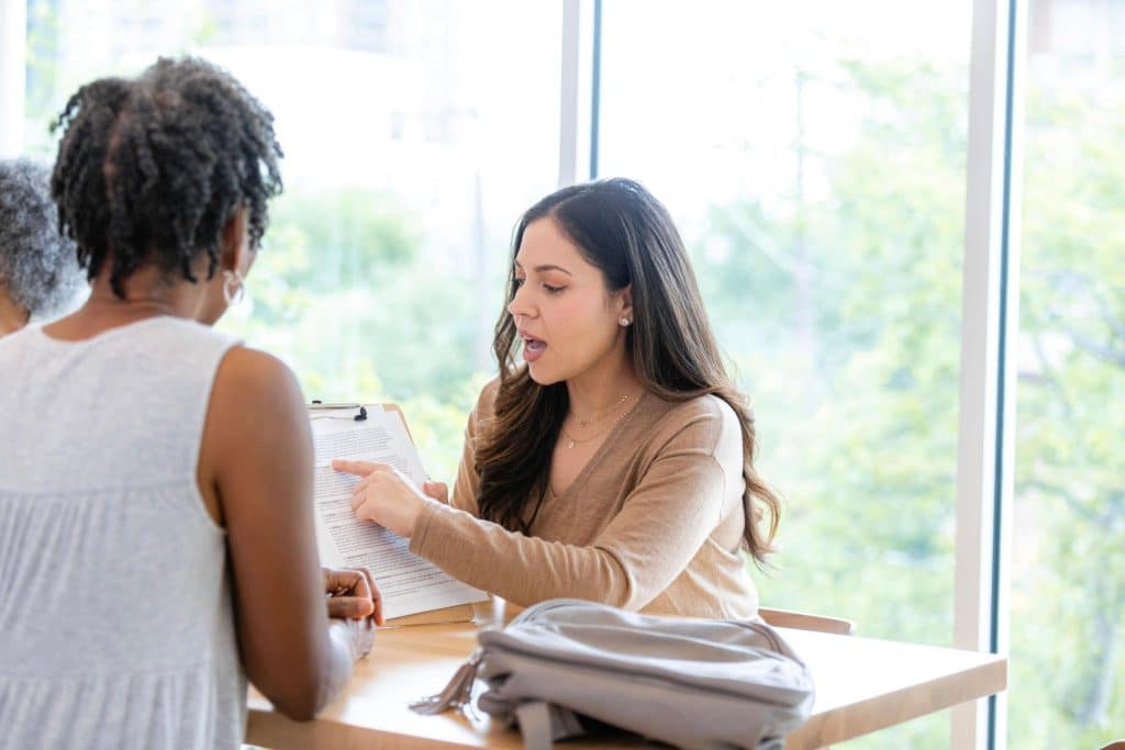 One-on-one sequestration coaching session explaining the legal process and helping a client understand their options.